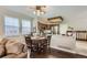 Cozy breakfast nook next to an open kitchen with stainless steel appliances and granite countertops at 6376 S Pierson St, Littleton, CO 80127