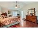 Comfortable main bedroom with hardwood floors, dresser, and a large walk-in closet at 6376 S Pierson St, Littleton, CO 80127