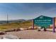 Sign for The Meadows Golf Club with mountain views, located at 7007 Meadows Golf Club Drive at 6376 S Pierson St, Littleton, CO 80127