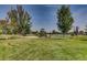 Community playground in a lush, grassy area for to enjoy at 6376 S Pierson St, Littleton, CO 80127