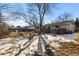 Backyard with mature tree, garden, and deck at 6730 Ingalls St, Arvada, CO 80003