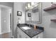 Bathroom features granite countertop vanity and a large mirror at 6730 Ingalls St, Arvada, CO 80003