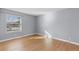 Spacious bedroom with wood floors and a large window at 6730 Ingalls St, Arvada, CO 80003