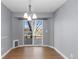 Dining area with light gray walls and sliding doors to deck at 6730 Ingalls St, Arvada, CO 80003