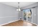 Dining area with light gray walls and sliding doors to deck at 6730 Ingalls St, Arvada, CO 80003