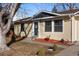 House exterior with landscaping and walkway at 6730 Ingalls St, Arvada, CO 80003