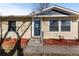 Front entry of the house with landscaping at 6730 Ingalls St, Arvada, CO 80003