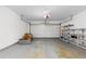 Attached garage with shelving for storage at 6730 Ingalls St, Arvada, CO 80003