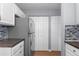 Kitchen features stainless steel refrigerator and ample cabinet storage at 6730 Ingalls St, Arvada, CO 80003