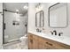 Modern bathroom with double vanity, walk-in shower, and elegant fixtures at 8117 W 90Th Dr, Westminster, CO 80021