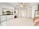 Bright main bedroom with large closet and TV at 8117 W 90Th Dr, Westminster, CO 80021