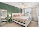 Main bedroom with ceiling fan and large windows at 8117 W 90Th Dr, Westminster, CO 80021