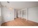 Finished basement area with built-in shelving, laminate floors, and storage cabinets at 6413 W 76Th Ave, Arvada, CO 80003