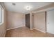 Basement area with neutral flooring, neutral walls and simple lighting at 6413 W 76Th Ave, Arvada, CO 80003