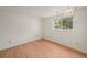 Bedroom with hardwood flooring and a window overlooking the outdoors at 6413 W 76Th Ave, Arvada, CO 80003