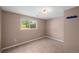 Bedroom with linoleum flooring, large window, and neutral colored walls at 6413 W 76Th Ave, Arvada, CO 80003