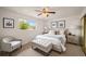 Cozy bedroom with neutral decor, including a queen-sized bed and soft carpet at 6413 W 76Th Ave, Arvada, CO 80003