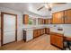Efficiently designed kitchen featuring classic wood cabinets at 6413 W 76Th Ave, Arvada, CO 80003