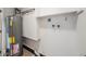 Utility room with a water heater and laundry hookups at 6413 W 76Th Ave, Arvada, CO 80003