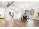 Open dining room with hardwood floors, archway views into the living and bedrooms at 1591 Holly St, Denver, CO 80220