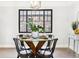 Stylish dining area featuring a modern table set and a large window with views at 1591 Holly St, Denver, CO 80220