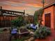 Backyard with lounge area, fire pit, and lush garden setting at 1256 S Pennsylvania St, Denver, CO 80210