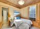 Cozy bedroom featuring unique ceiling texture, natural light, and stylish decor at 1256 S Pennsylvania St, Denver, CO 80210