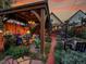 Backyard gazebo with dining set, chandelier, and cozy outdoor seating at 1256 S Pennsylvania St, Denver, CO 80210