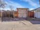 View of an outdoor shed with double doors on a sunny day, showing storage potential at 1256 S Pennsylvania St, Denver, CO 80210