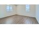 Simple bedroom with neutral walls and hardwood floors at 13840 Deertrack Ln, Parker, CO 80134