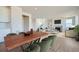 Dining room with wood table and access to kitchen at 13840 Deertrack Ln, Parker, CO 80134