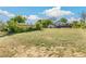Expansive backyard with green grass and mature trees, ideal for recreation and leisure at 5385 W 51St Ave, Denver, CO 80212