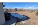 Large backyard with snow on the ground and trash bins at 5385 W 51St Ave, Denver, CO 80212