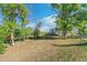Charming single story home with a welcoming front entrance framed by mature trees at 5385 W 51St Ave, Denver, CO 80212
