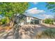 Charming home with well-manicured landscaping, lush green trees, an oversized driveway and two car garage at 5385 W 51St Ave, Denver, CO 80212