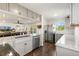 Bright kitchen featuring gray cabinets, stainless steel appliances, and hardwood floors at 5385 W 51St Ave, Denver, CO 80212