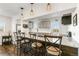 Eat-in kitchen featuring granite countertops, stainless steel appliances, stylish pendant lights, and bar stool seating at 5385 W 51St Ave, Denver, CO 80212