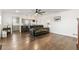 Open-concept living room featuring hardwood floors and seamless connection to the kitchen and dining area at 5385 W 51St Ave, Denver, CO 80212