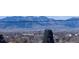 Stunning mountain views from this property, with a water tower, trees and city views at 5385 W 51St Ave, Denver, CO 80212