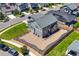 Aerial view showcasing the property, backyard, and proximity to surrounding neighborhood amenities at 9716 Uravan St, Commerce City, CO 80022