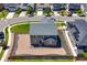 Aerial view of backyard with rock landscaping, wooden fence, and surrounding neighborhood at 9716 Uravan St, Commerce City, CO 80022
