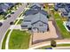 Aerial view of the home showing the backyard, landscaping, and surrounding neighborhood at 9716 Uravan St, Commerce City, CO 80022