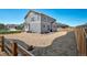 Well-maintained backyard featuring rock landscaping and a wooden fence, perfect for outdoor enjoyment at 9716 Uravan St, Commerce City, CO 80022