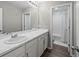 Well-lit bathroom showcasing a large mirror and sink with plenty of counter space at 9716 Uravan St, Commerce City, CO 80022