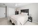 Inviting bedroom featuring a ceiling fan, closet and bedside table at 9716 Uravan St, Commerce City, CO 80022