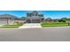 Two-story home featuring a three-car garage, landscaped yard, and a well-maintained lawn at 9716 Uravan St, Commerce City, CO 80022