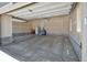 Spacious two-car garage with painted walls, offering plenty of room for parking and storage at 9716 Uravan St, Commerce City, CO 80022