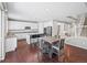 Spacious, updated kitchen boasts white cabinets, stainless steel appliances, and an island with seating at 9716 Uravan St, Commerce City, CO 80022
