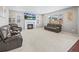 Inviting living room with a fireplace, large windows, and comfortable seating at 9716 Uravan St, Commerce City, CO 80022