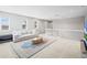 Open floor plan showcases the living room with natural light and neutral tones at 9716 Uravan St, Commerce City, CO 80022